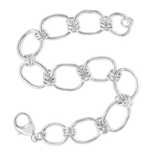 silver link bracelet on white background
