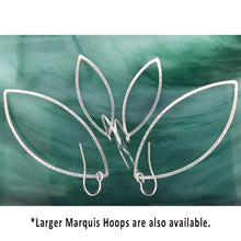 Load image into Gallery viewer, silver hammered leaf shaped hoops on ear wires in medium and large sizes on green background