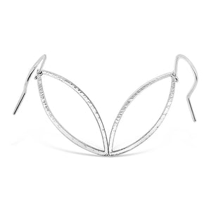 silver hammered leaf shaped hoops on ear wires on white background
