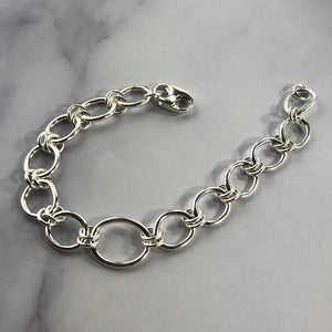 silver link bracelet on marble background